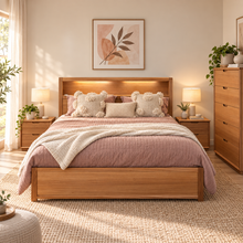 Load image into Gallery viewer, A warm wood platform bed with a built-in headboard light, styled in a cozy bedroom with pink bedding, textured pillows, bedside tables with lamps, and a matching wooden dresser.