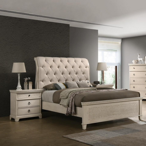 White timber bedframe with upholstered bedhead and cane feature foot