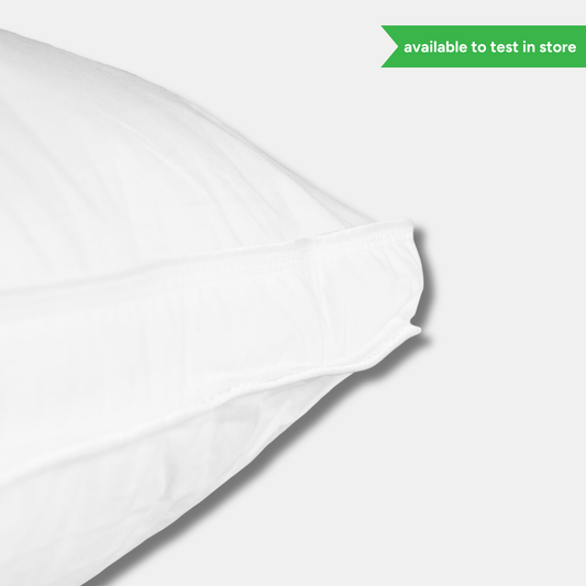 Outlast cotton pillow styled on a bed for everyday sleep comfort