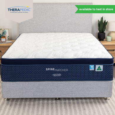 Spine Matcher mattress on base in a styled bedroom, featuring stretch knit top and Australian Made label. Available to test in-store