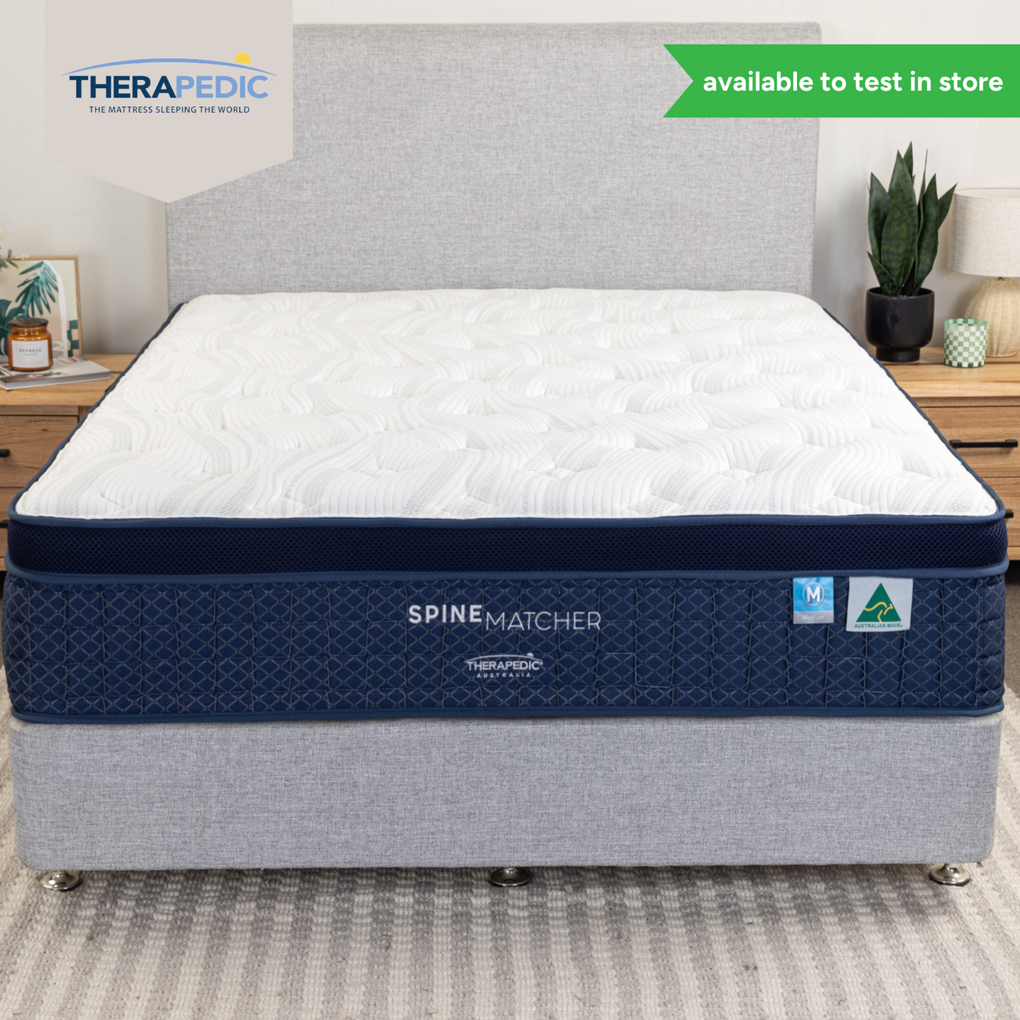 Spine Matcher mattress on base in a styled bedroom, featuring stretch knit top and Australian Made label. Available to test in-store